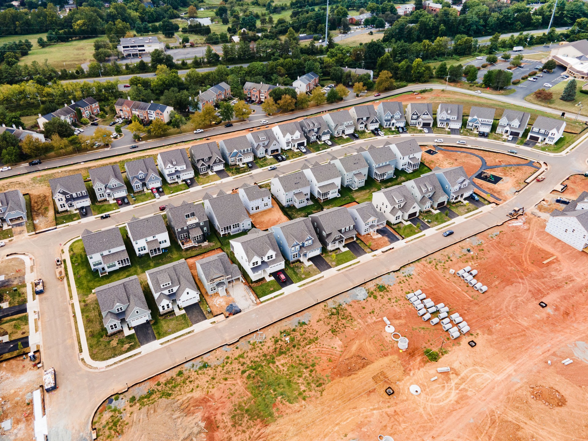 New houses on the construction site and a prepared place for construction. drone view.